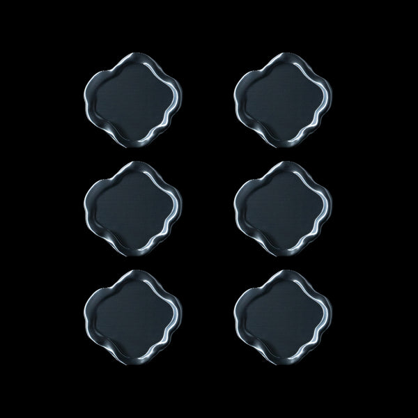 Lot de six dessous de verre Fuso en coloris Aether, disposés en deux colonnes sur fond noir